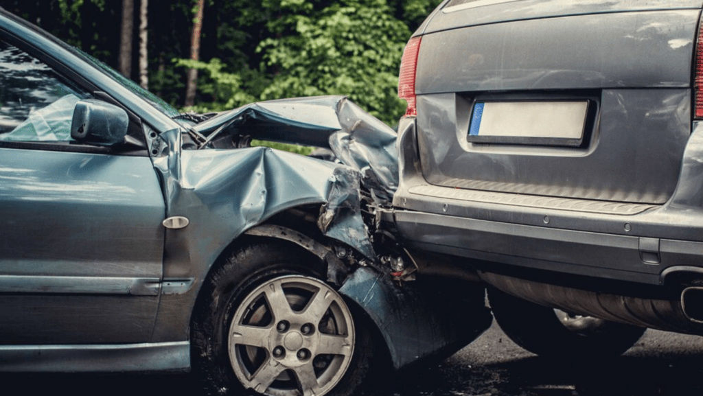 Car accident with two vehicles. A sedan rear-end collision with an SUV causing extensive damage.