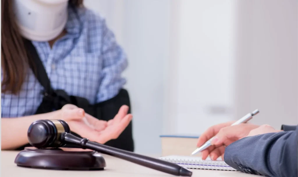 Pasadena personal injury attorney discussing case details with client at office.