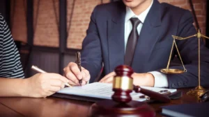 A Hollywood personal injury lawyer discussing legal options and potential compensation with an injured client at a law office.