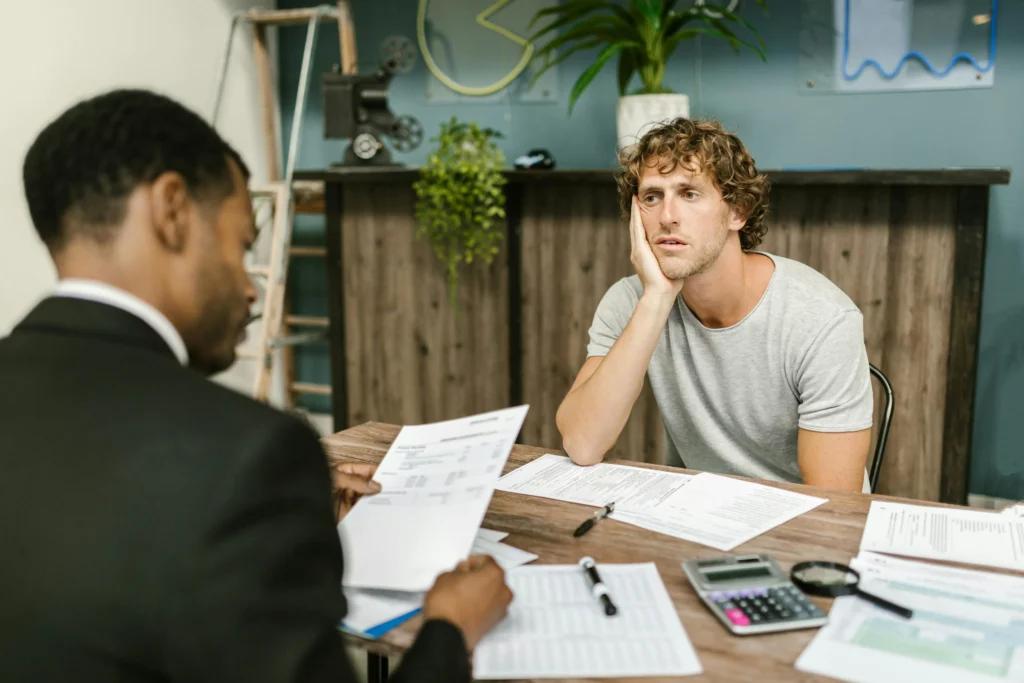 Man consulting with an Atwater Village truck accident lawyer to discuss compensation and legal options after a serious commercial truck crash.