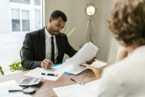 Glendale Rideshare Accident Lawyer assisting a client with legal advice.