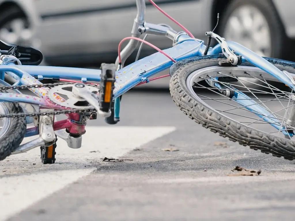 Montrose Bicycle Accident Lawyer (1) Damaged bicycle lying on the street after a traffic collision.