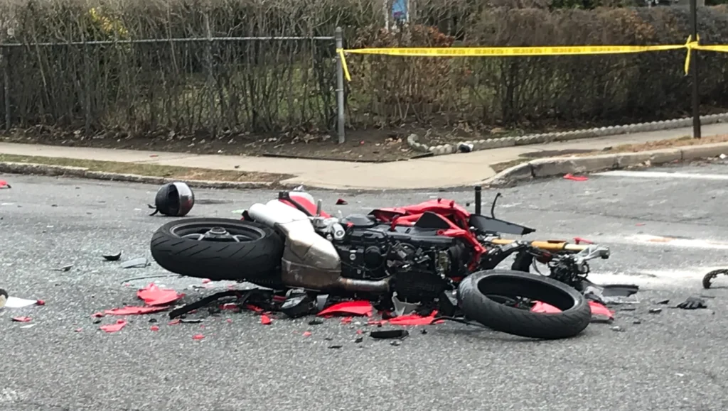 Destroyed motorcycle after a crash in California, highlighting the need for a motorcycle accident lawyer.