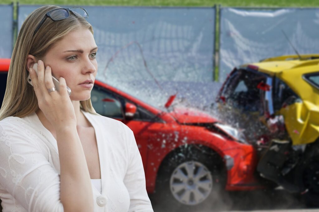 Woman calling for help after a car accident in California, representing the need for a car accident lawyer.