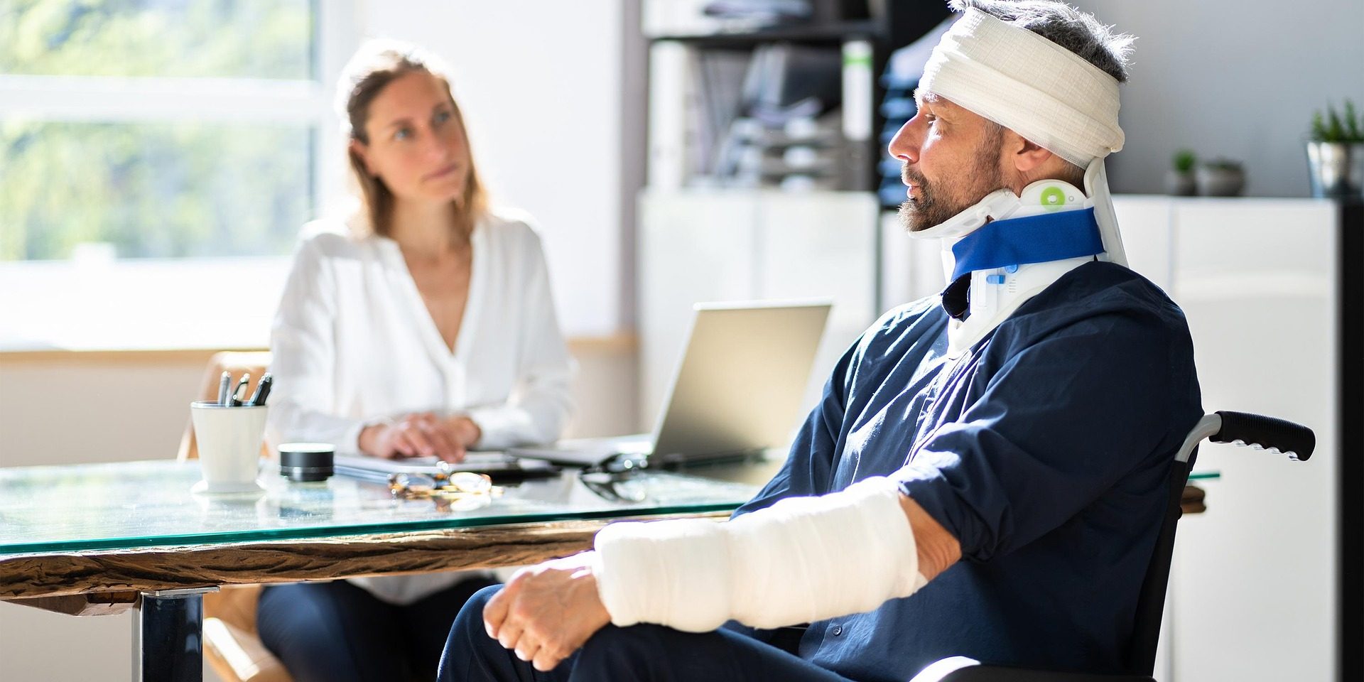 Injured man consulting with a California catastrophic injury lawyer.