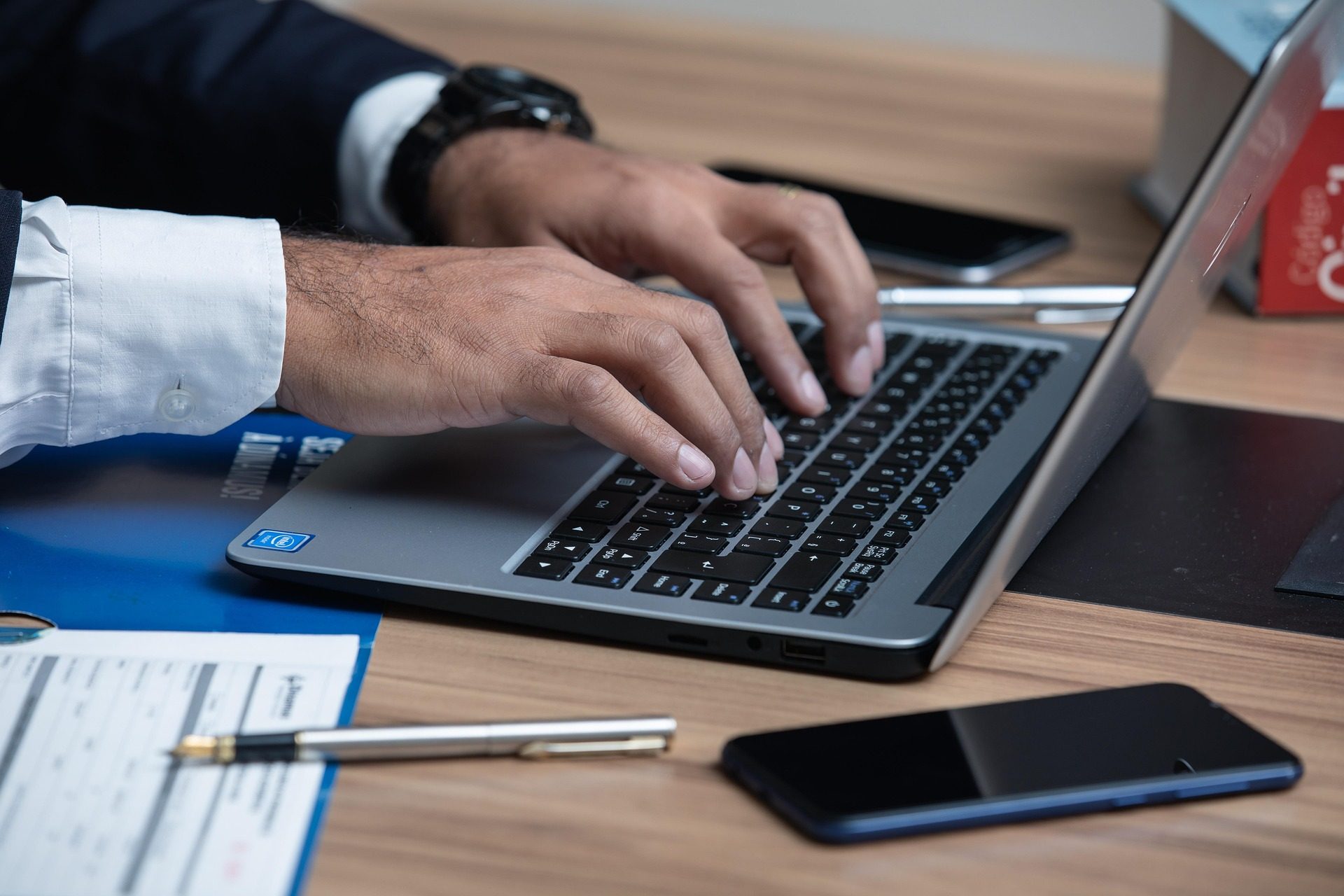 California truck accident lawyer using laptop to review case details.