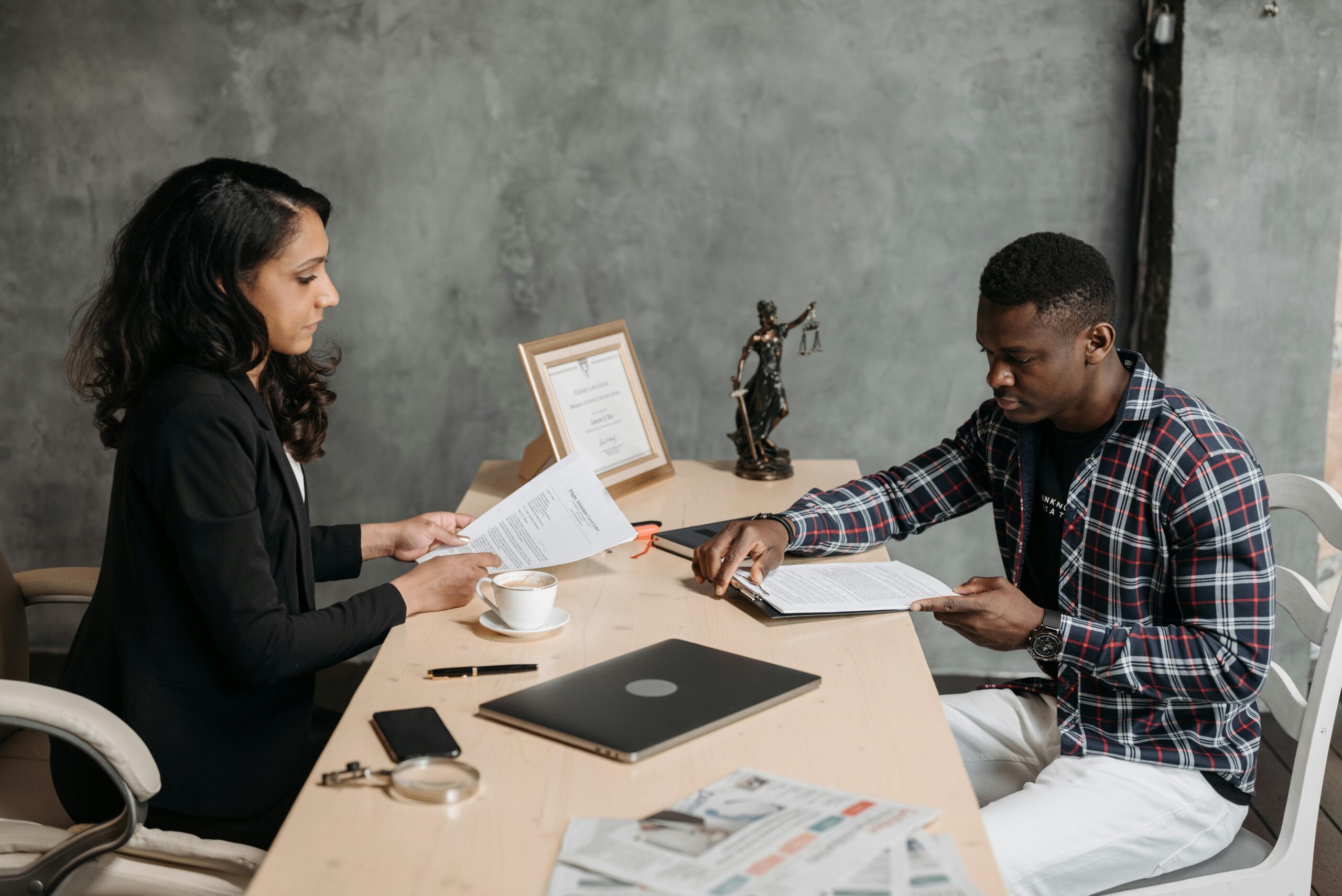 Attorney consulting male client regarding an Amazon truck accident claim in California.