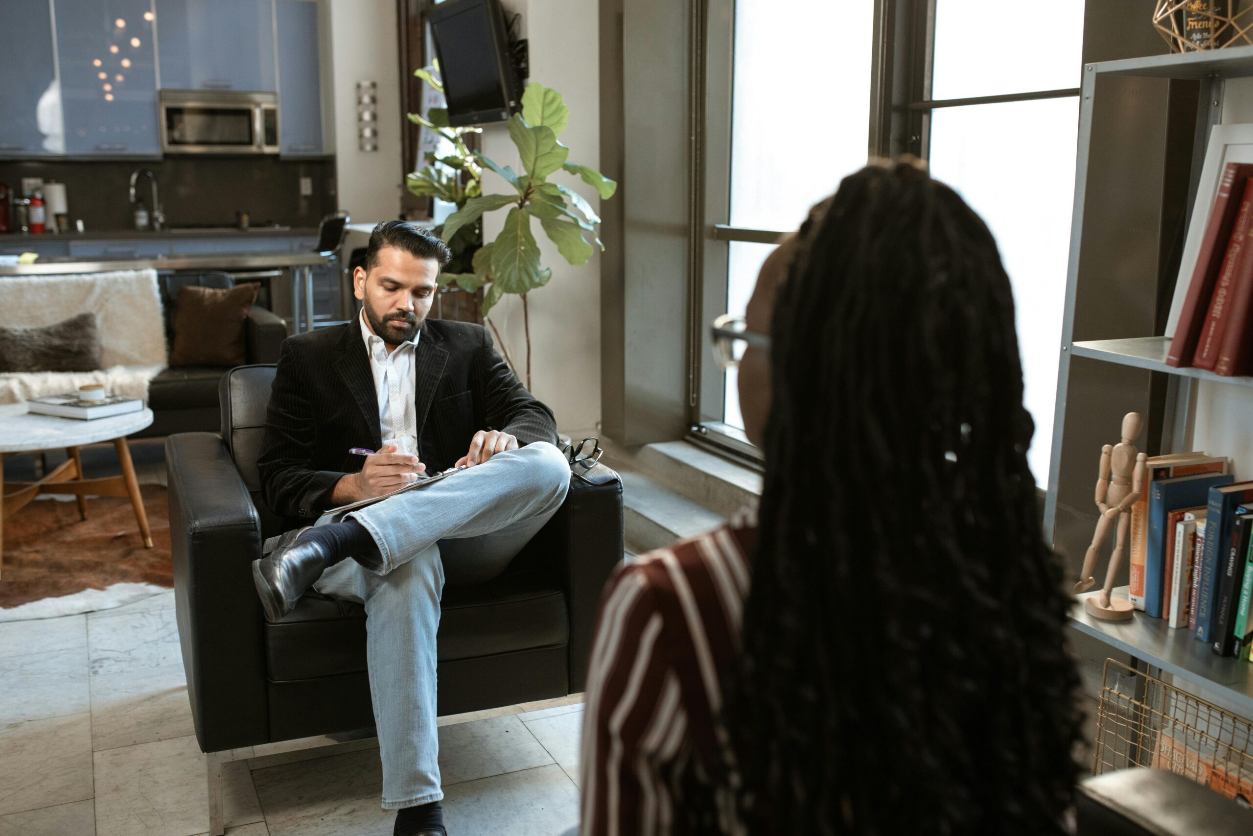 Lawyer meeting with woman to discuss her California delivery truck accident case.