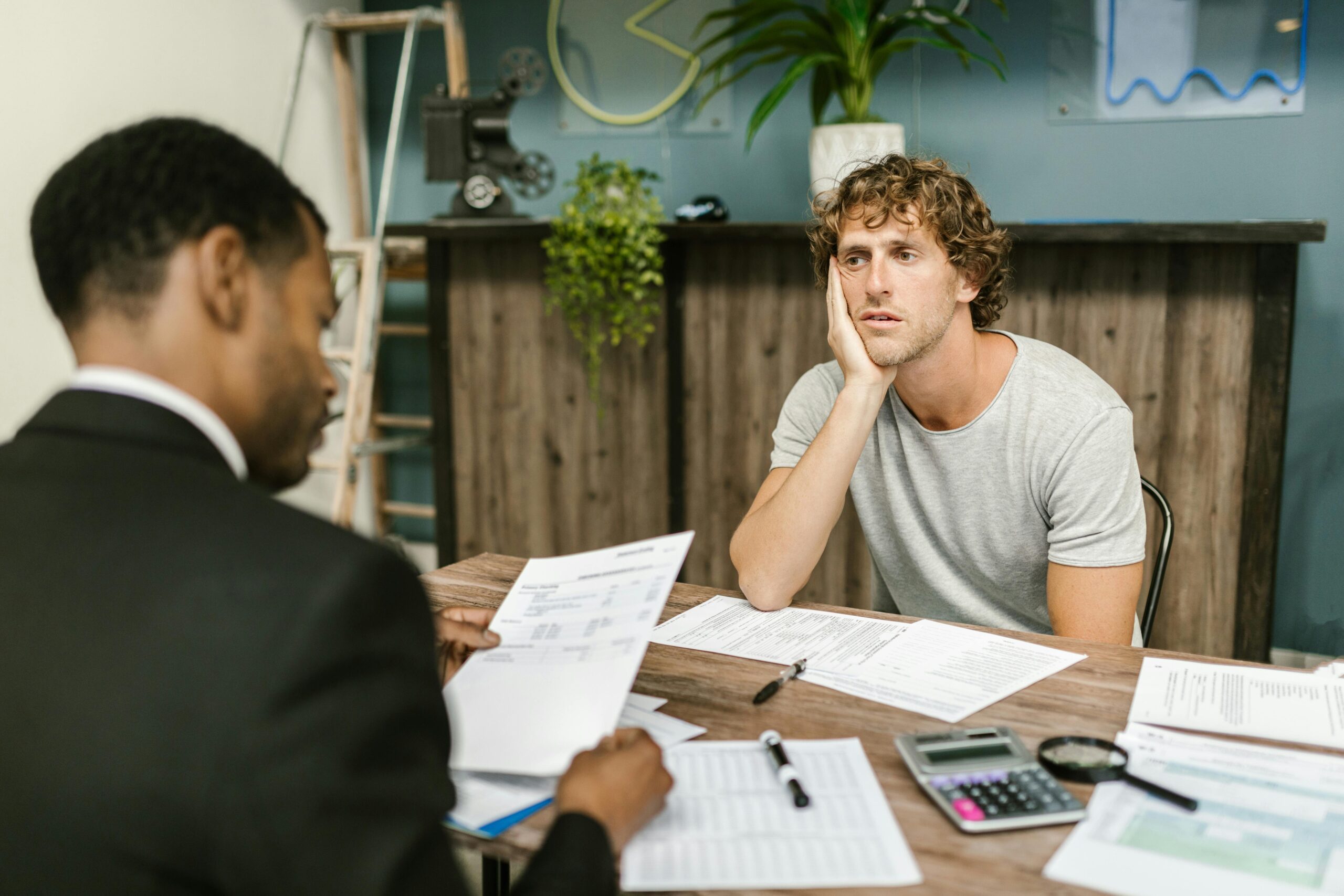 Attorney meeting with male client about a premises liability case in California.