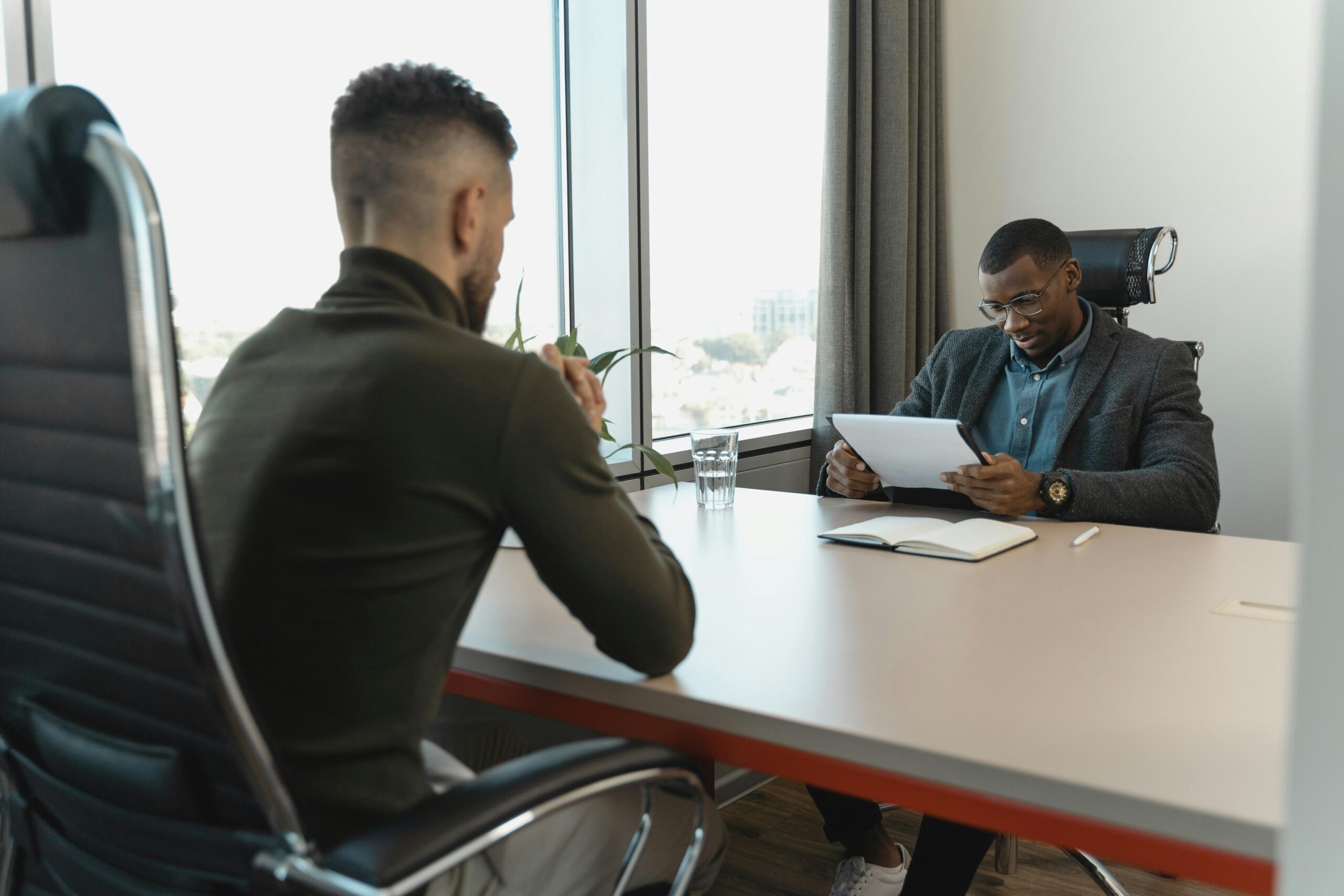 Lawyer advising man on his California underinsured motorist accident case.