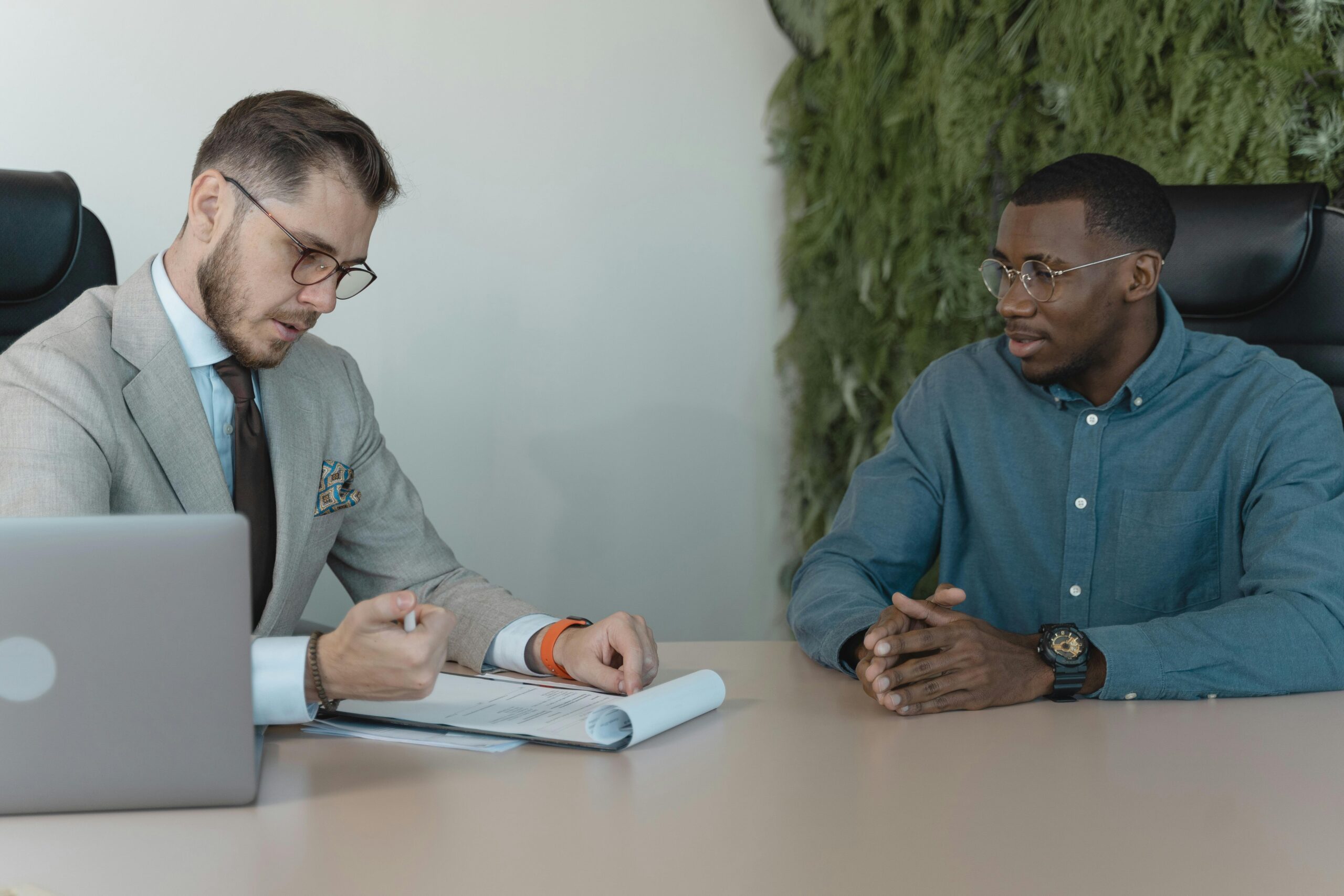 Lawyer advising man on his California premises liability claim.