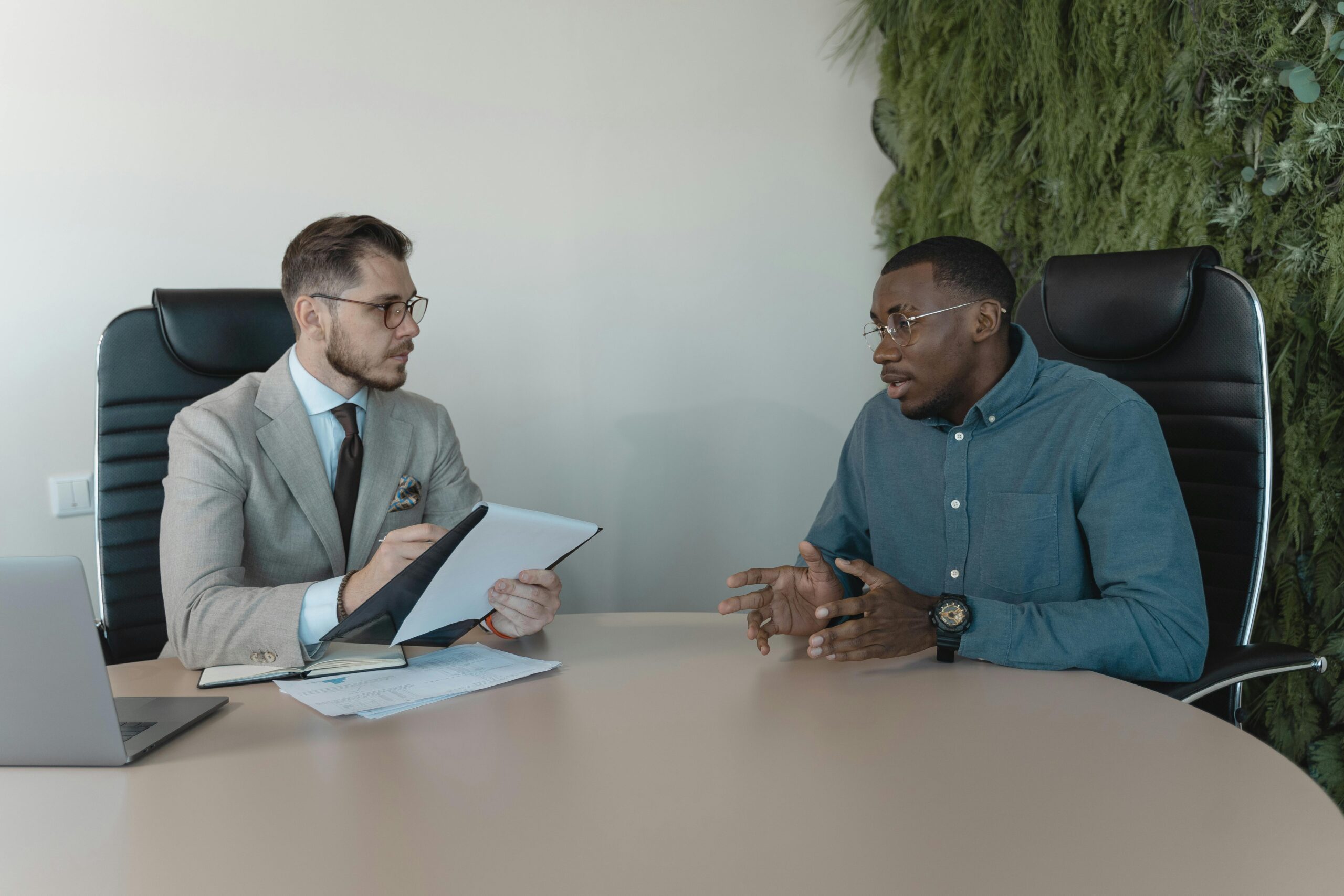 Lawyer advising man on his California uninsured motorist accident case.