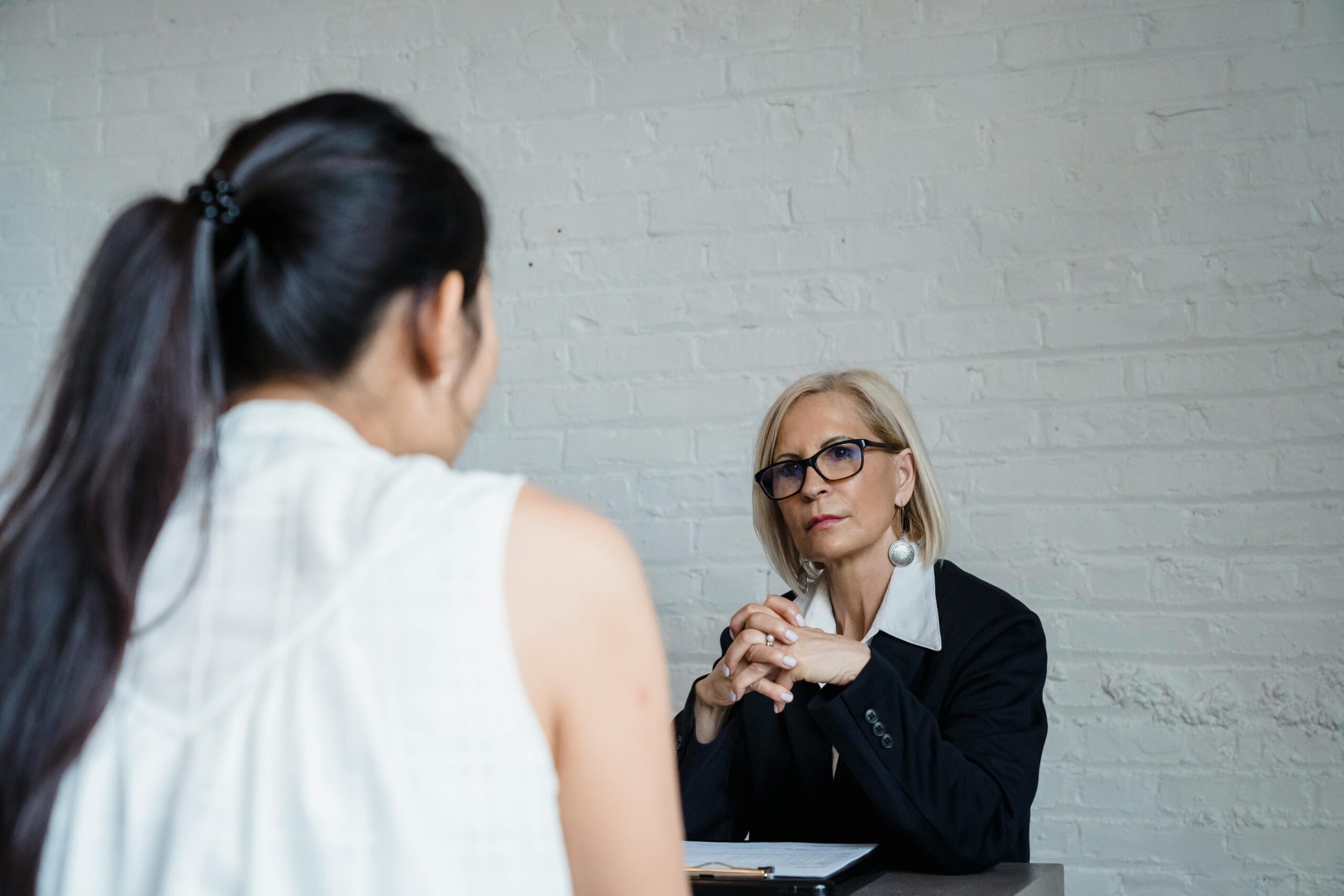 Attorney advising female client about a delivery truck accident claim in California.