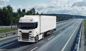 Large cargo truck driving on a freeway through the Inland Empire, illustrating a Riverside truck accident injury claim and commercial vehicle litigation.