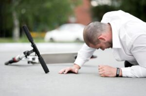 Injured woman reacting after a slip and fall accident, representing personal injury claims and average slip and fall settlements in California.