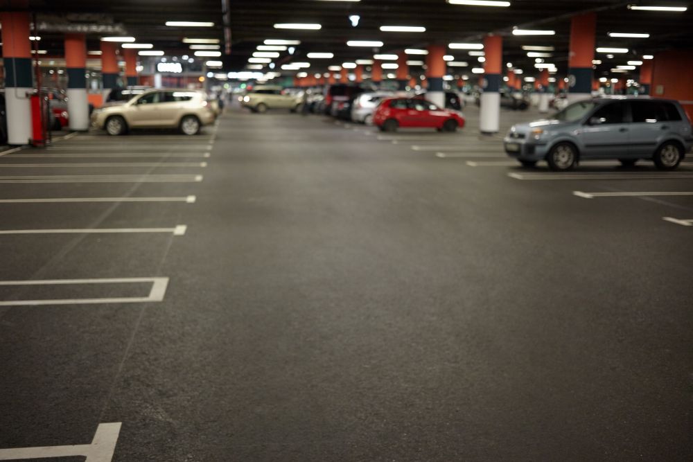 Nearly empty parking lot where vehicle accidents commonly occur, representing insurance coverage for parking lot accidents in California.