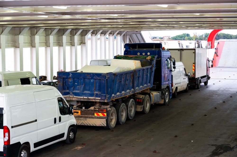 Semi-truck merging onto the I-5 freeway through Orange County in heavy traffic